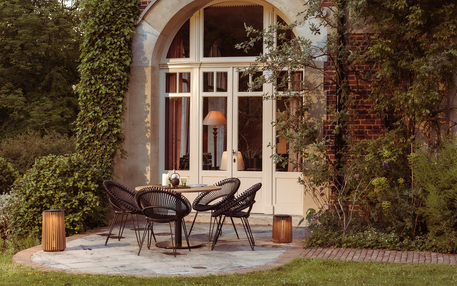 Roxy dining chair with Ronda bistro table and Maya lanterns